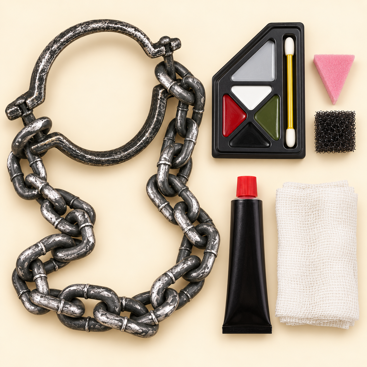 A weathered chain-and-shackle costume prop, zombie makeup palette with sponges, and fake blood with white gauze on a cream background.