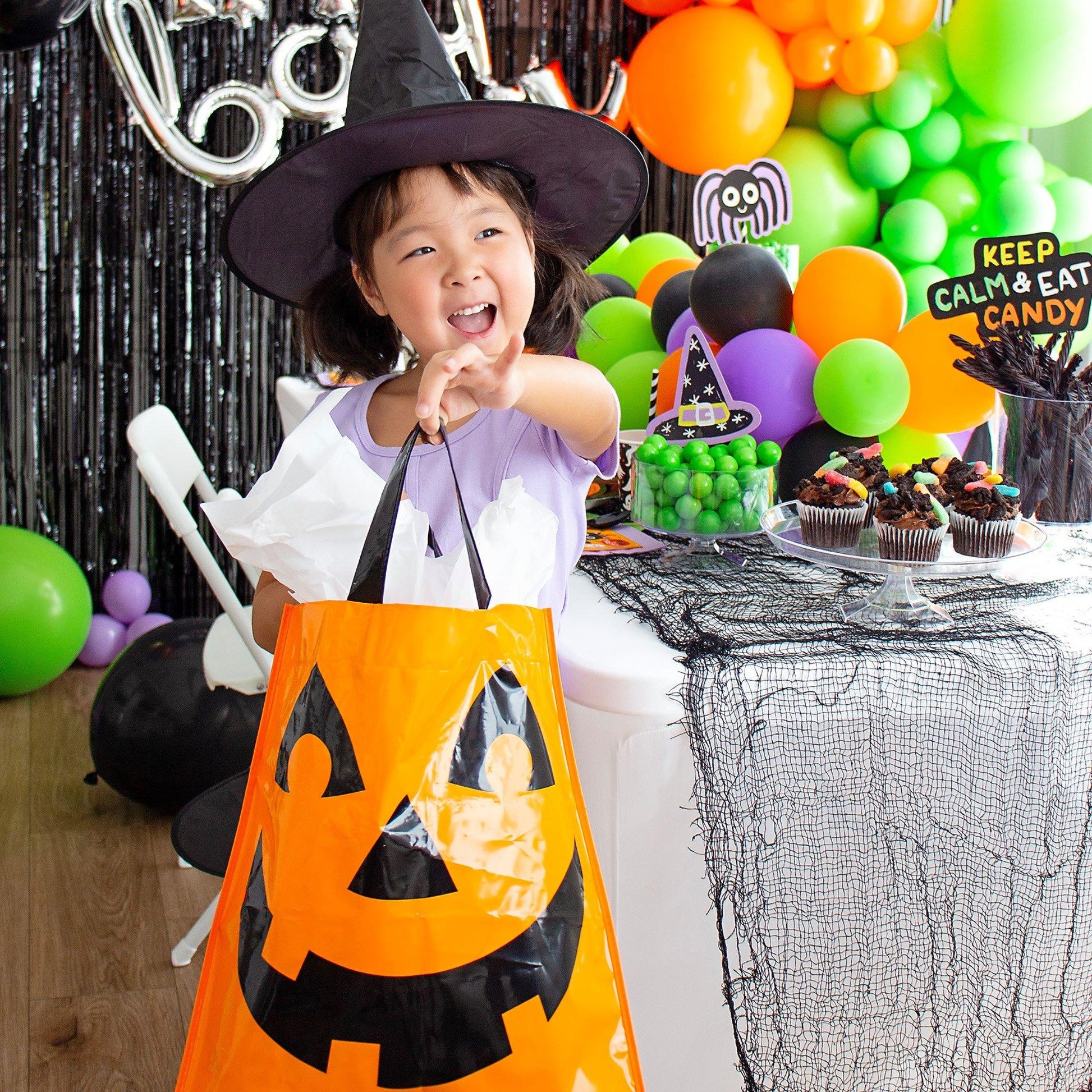 Orange jack-o-lantern trick-or-treat bag with handles